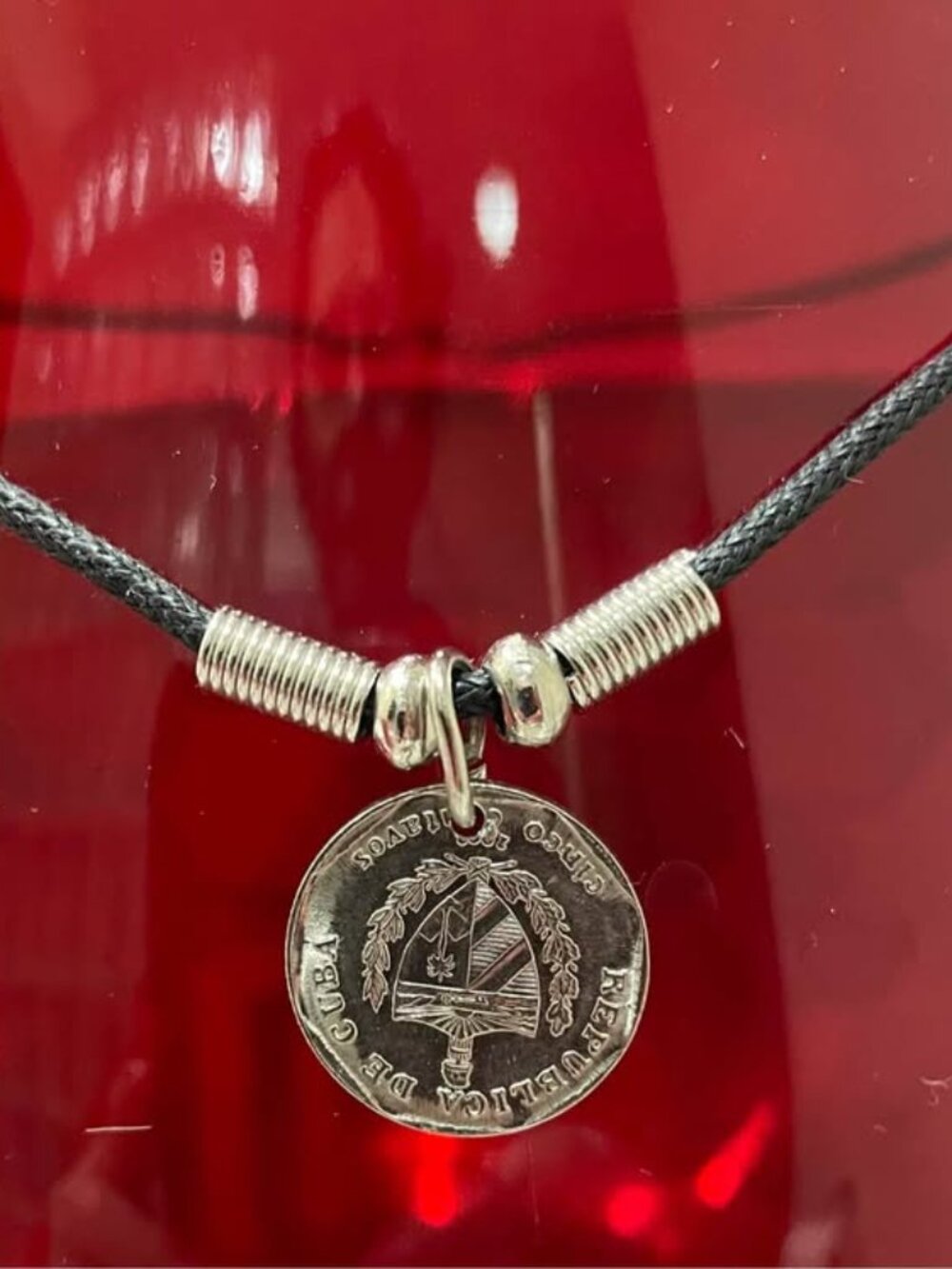 Necklace with a pendant made from an authentic coin a silver-plated 25 Centavos